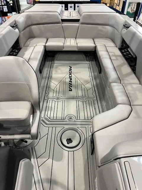 Slide: The Image of 2025 Moomba Tykon boat interior with spacious seating and sleek design. - 10