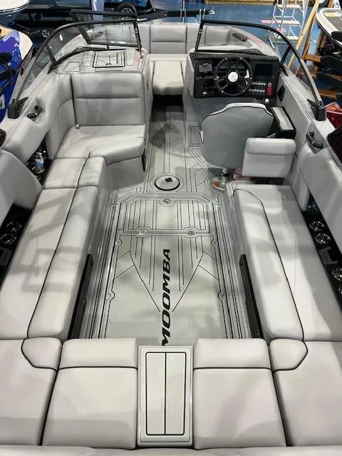 Slide: The Image of 2025 Moomba Tykon boat interior with sleek seating and modern dashboard. - 5