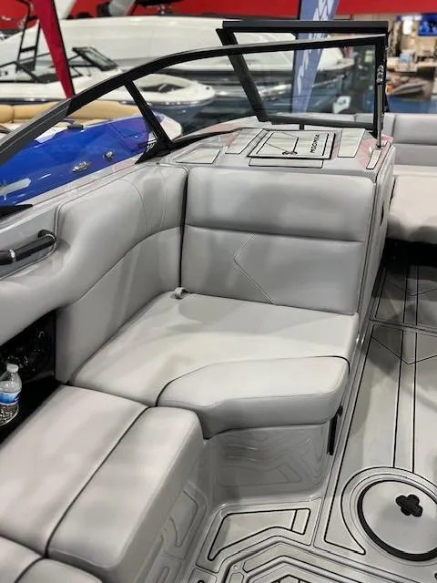 Slide: The Image of 2025 Moomba Tykon boat interior with gray seating and modern design. - 9