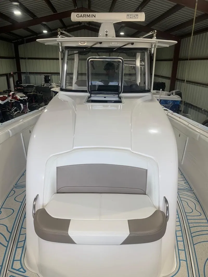Slide: The Image of 2016 Edgewater 368 CC boat with Garmin radar in a storage facility. - 18