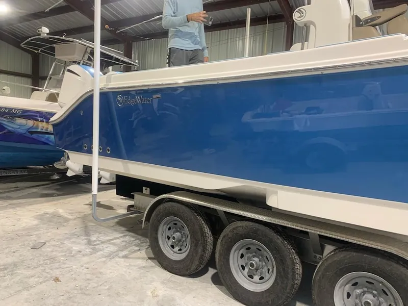 Slide: The Image of 2016 Edgewater 368 CC boat on trailer in indoor storage facility. - 5