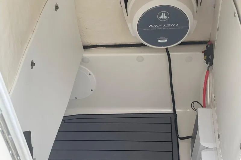 Slide: The Image of 2018 NauticStar 265 XTS boat interior with speaker and wiring. - 11