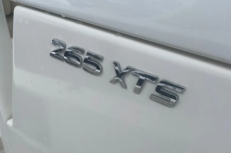 Slide: The Image of Close-up of 2018 NauticStar 265 XTS boat emblem. - 2
