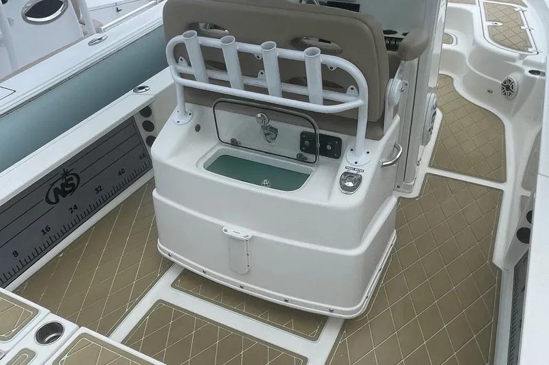 Slide: The Image of 2018 NauticStar 265 XTS boat interior with seating and storage compartments. - 9