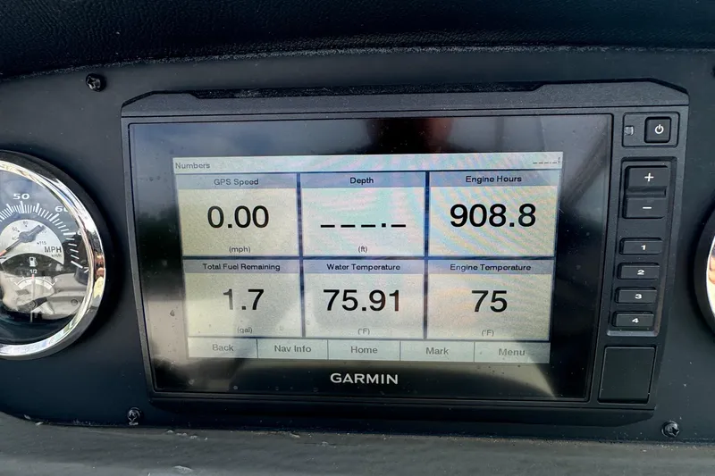 Slide: The Image of Garmin display on 2020 Crownline 255 SS showing engine hours and temperatures. - 10