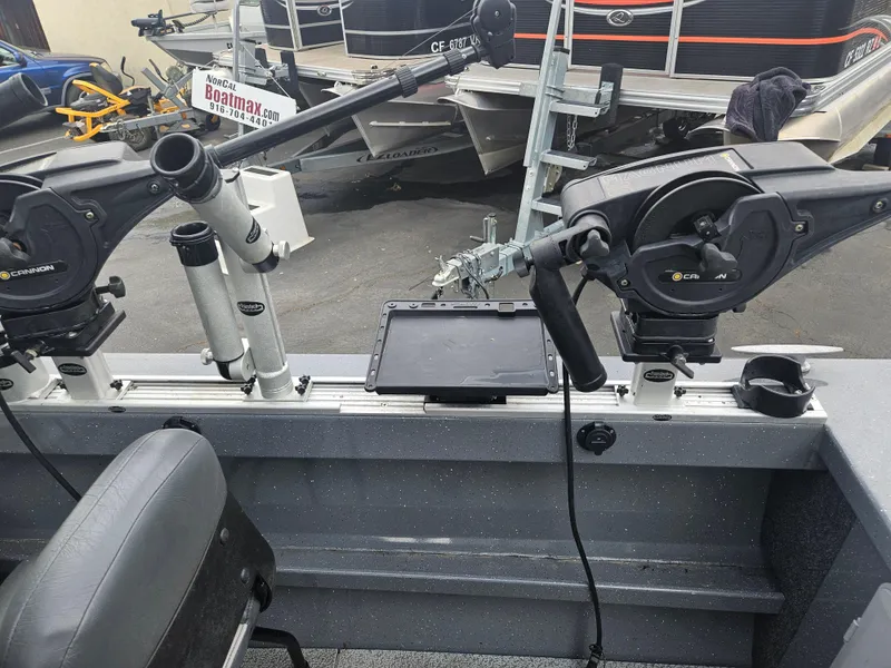 Slide: The Image of 2022 RH Boats 22 Coastal Hard Top interior with fishing equipment and controls. - 12