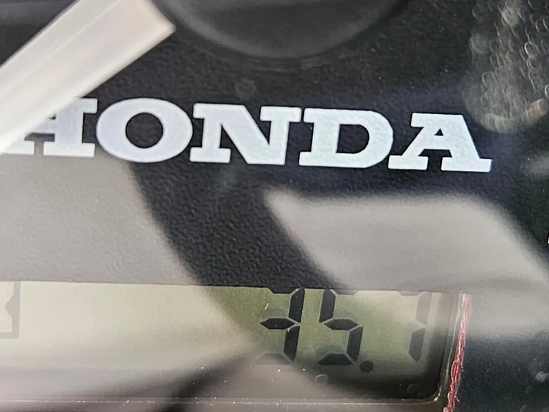 Slide: The Image of Close-up of Honda display on 2022 RH Boats 22 Coastal Hard Top. - 14
