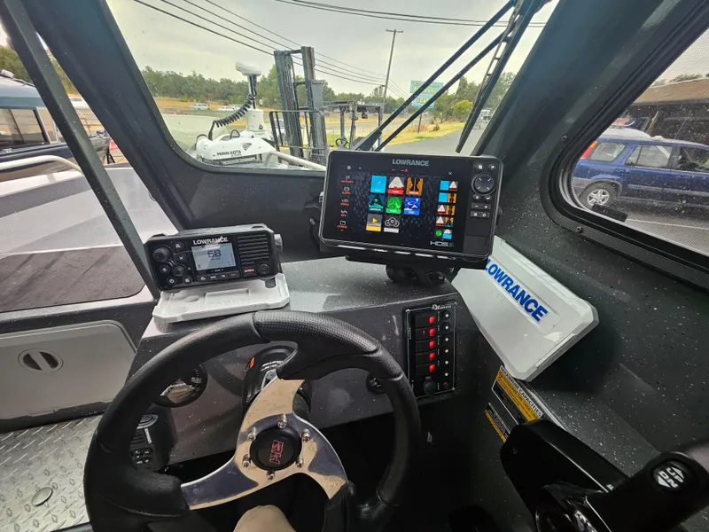 Slide: The Image of Interior of 2022 RH Boats 22 Coastal Hard Top with navigation equipment. - 16