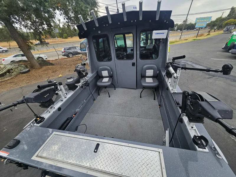 Slide: The Image of 2022 RH Boats 22 Coastal Hard Top interior with seating and fishing equipment. - 20