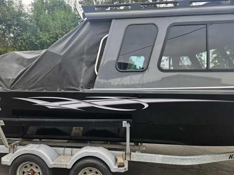 Slide: The Image of 2022 RH Boats 22 Coastal Hard Top on trailer, side view. - 21
