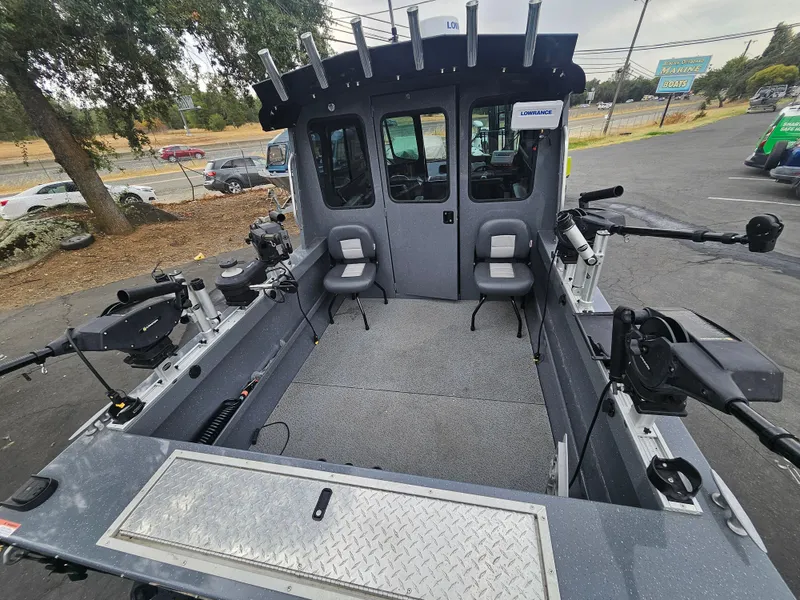 Slide: The Image of 2022 RH Boats 22 Coastal Hard Top interior with seating and fishing equipment. - 23