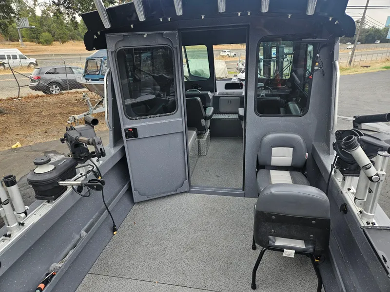 Slide: The Image of 2022 RH Boats 22 Coastal Hard Top interior with seating and fishing equipment. - 4