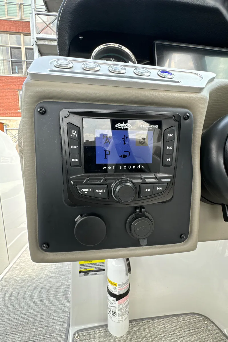 Slide: The Image of 2023 Crownline 255 XS boat dashboard with Wet Sounds audio system. - 20