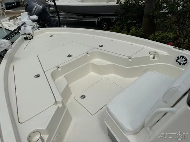 Slide: The Image of 2025 Skeeter SX230 boat deck with seating and storage compartments. - 28