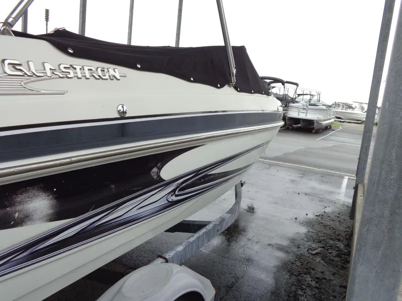 Slide: The Image of 2009 Glastron GT 185 boat on trailer in parking lot. - 32