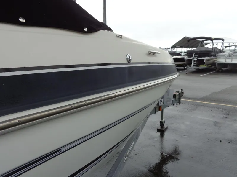 Slide: The Image of 2009 Glastron GT 185 boat on trailer in parking lot. - 33