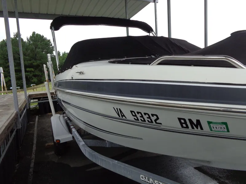 Slide: The Image of 2009 Glastron GT 185 boat on trailer under shelter. - 34
