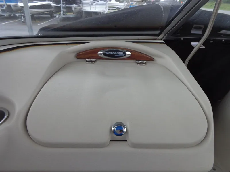 Slide: The Image of 2009 Glastron GT 185 boat dashboard with storage compartment. - 44