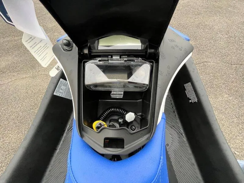 Slide: The Image of 2024 Sea-Doo Spark storage compartment with iBR and audio system, open view. - 16