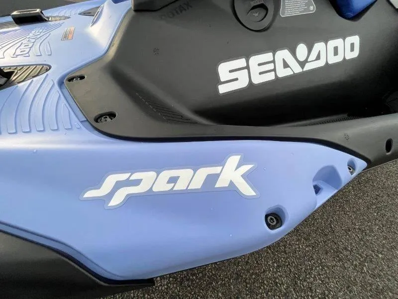 Slide: The Image of 2024 Sea-Doo Spark jet ski, blue and black, featuring iBR and audio system. - 31