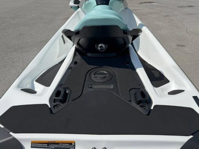 Slide: The Image of 2024 Sea-Doo GTI 130 jet ski, rear view, showcasing sleek design and seating. - 10