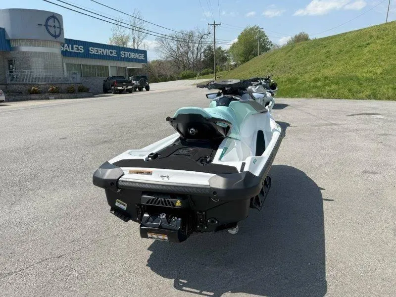 Slide: The Image of 2024 Sea-Doo GTI 130 jet ski parked near sales and service building. - 19