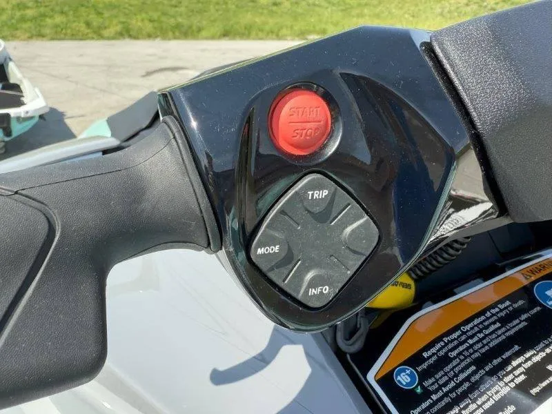 Slide: The Image of 2024 Sea-Doo GTI 130 handlebar controls with start/stop button and mode options. - 27