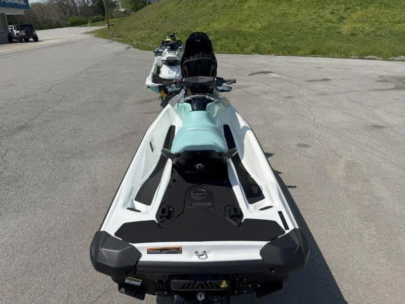 Slide: The Image of 2024 Sea-Doo GTI 130 jet ski parked on pavement, showcasing sleek design and features. - 29