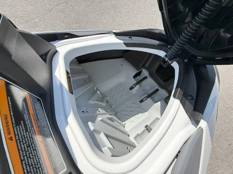 Slide: The Image of 2024 Sea-Doo GTI 130 storage compartment open, showcasing interior space and design. - 30