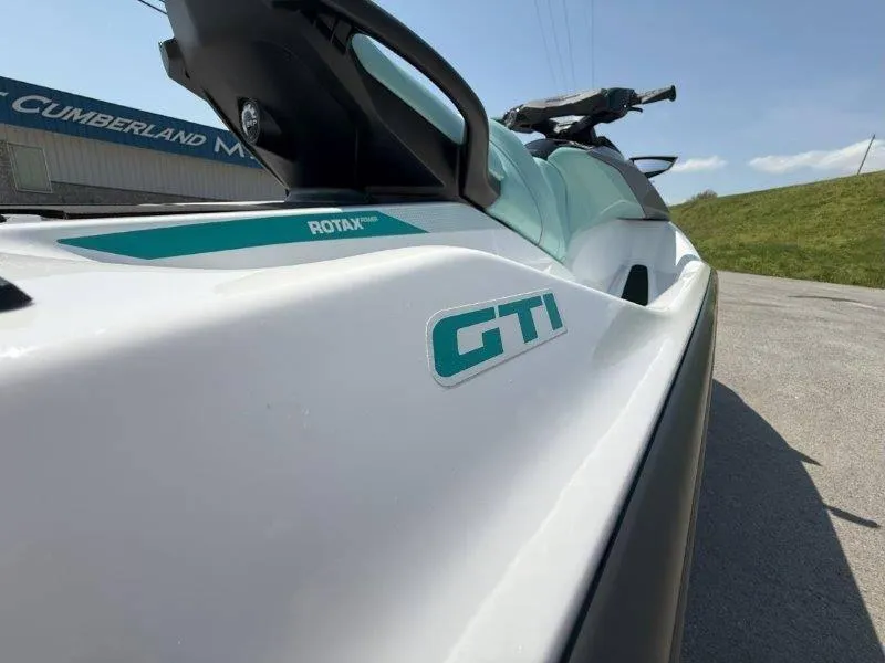 Slide: The Image of 2024 Sea-Doo GTI 130 jet ski, close-up view, showcasing sleek design and branding. - 31