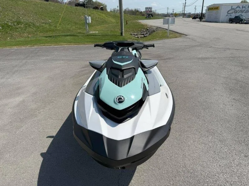 Slide: The Image of 2024 Sea-Doo GTI 130 jet ski in a parking lot, front view. - 4