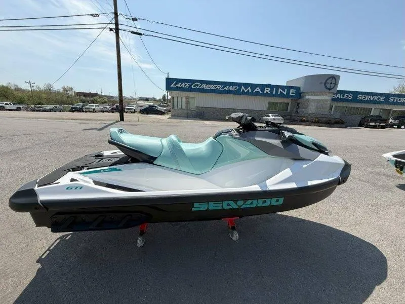 Slide: The Image of 2024 Sea-Doo GTI 130 jet ski displayed at Lake Cumberland Marine dealership. - 6
