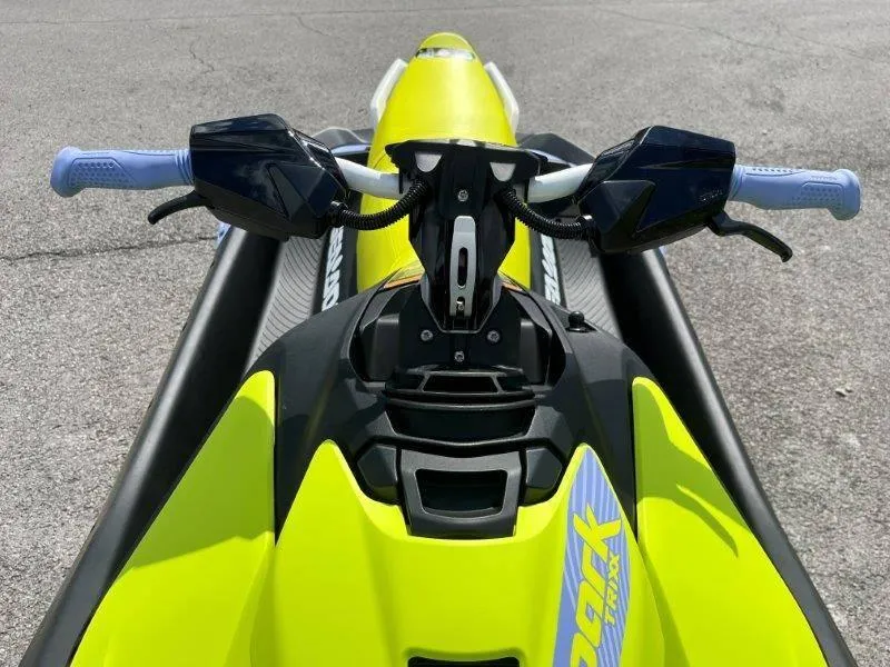 Slide: The Image of 2024 Sea-Doo Spark Trixx jet ski, vibrant yellow, handlebars view. - 17