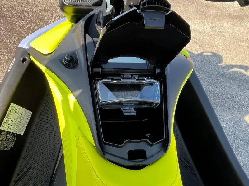 Slide: The Image of 2024 Sea-Doo Spark Trixx storage compartment open, showcasing interior design and features. - 24