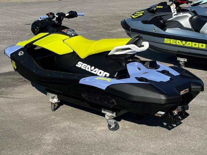 Slide: The Image of 2024 Sea-Doo Spark Trixx jet ski with vibrant yellow seat and sleek design. - 4