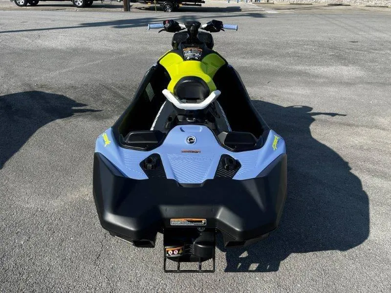 Slide: The Image of 2024 Sea-Doo Spark Trixx jet ski, vibrant colors, parked on pavement. - 8