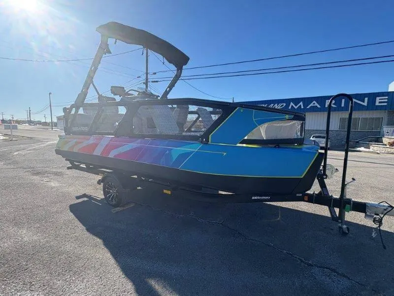 Slide: The Image of 2023 Sea-Doo SWITCH SPORT 21' 230HP boat on trailer, vibrant design, sunny day. - 12