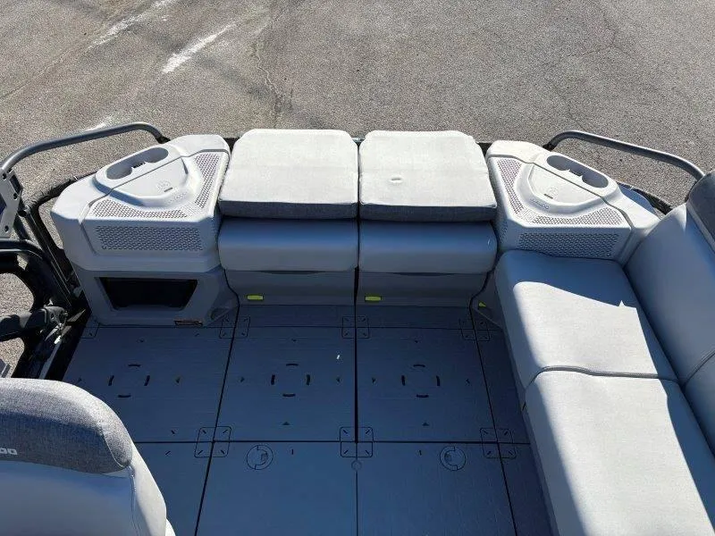 Slide: The Image of 2023 Sea-Doo SWITCH SPORT 21' 230HP boat interior with gray seating and spacious deck. - 25