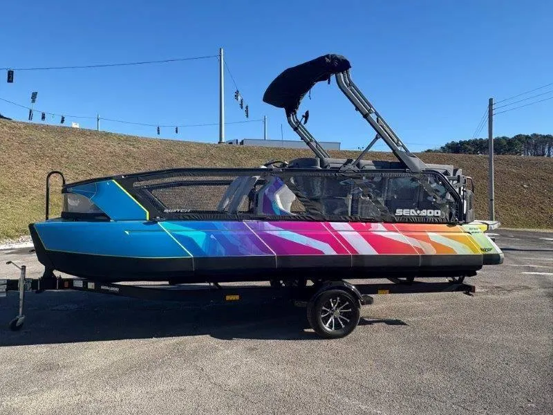 Slide: The Image of 2023 Sea-Doo SWITCH SPORT 21' 230HP with vibrant rainbow design on trailer. - 3