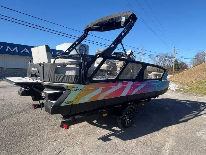 Slide: The Image of 2023 Sea-Doo SWITCH SPORT 21' 230HP boat with colorful design on a trailer. - 4
