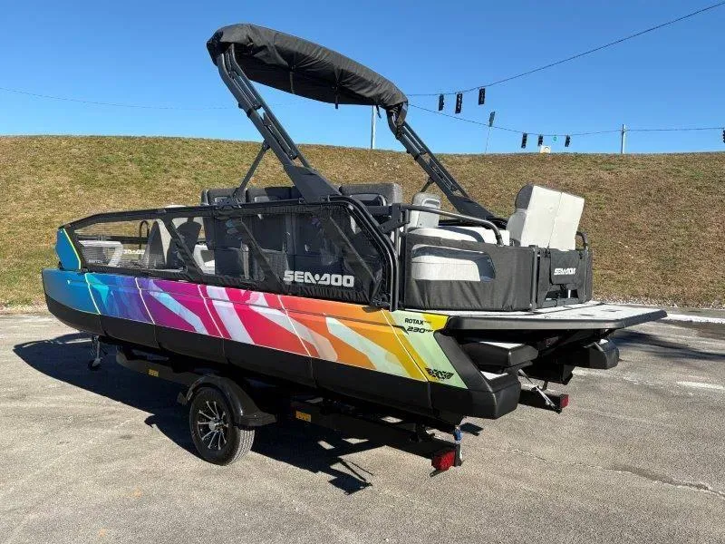 Slide: The Image of 2023 Sea-Doo SWITCH SPORT 21' 230HP boat with vibrant design on a trailer. - 5