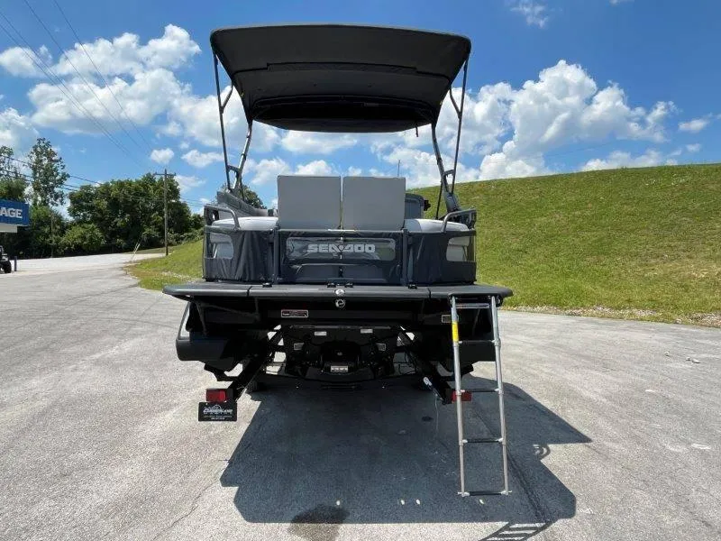 Slide: The Image of 2024 Sea-Doo Switch Cruise 21' 230HP pontoon boat, rear view with ladder and canopy. - 14