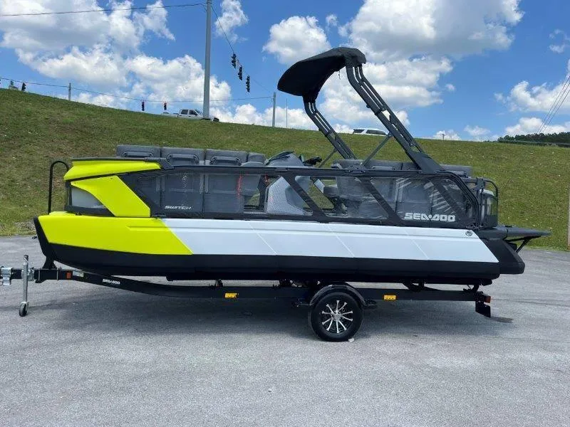 Slide: The Image of 2024 Sea-Doo Switch Cruise 21' 230HP pontoon boat on trailer, vibrant yellow and black design. - 37