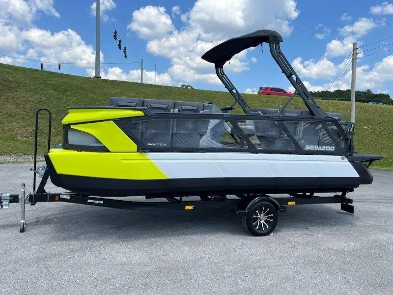 Slide: The Image of 2024 Sea-Doo Switch Cruise 21' 230HP on trailer, vibrant yellow and black design. - 39