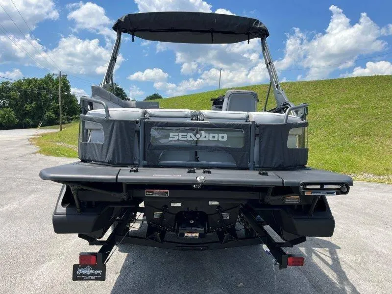Slide: The Image of 2024 Sea-Doo Switch Cruise 21' 230HP pontoon boat, rear view, parked outdoors. - 42