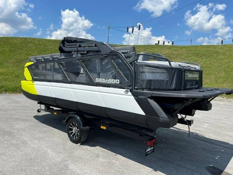 Slide: The Image of 2024 Sea-Doo Switch Cruise 21' 230HP on trailer, parked outdoors under blue sky. - 44