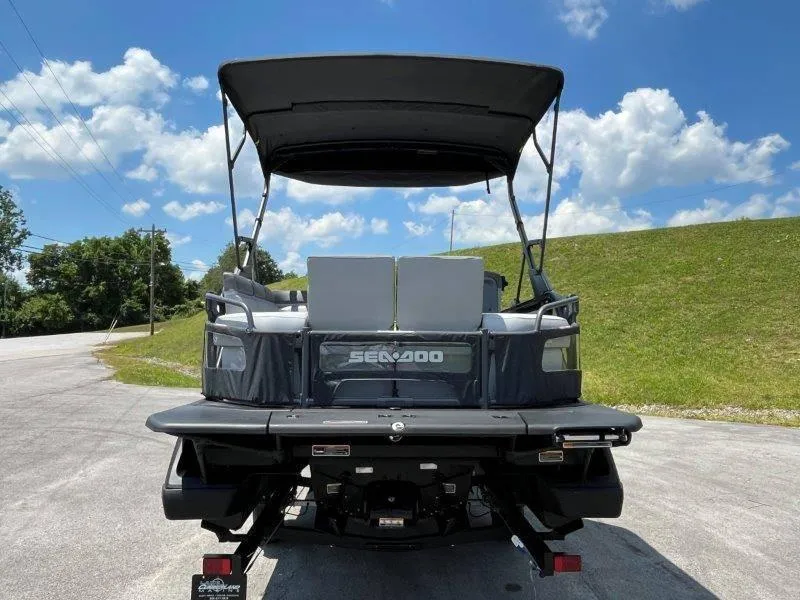 Slide: The Image of 2024 Sea-Doo Switch Cruise 21' 230HP boat, rear view, sunny day. - 6