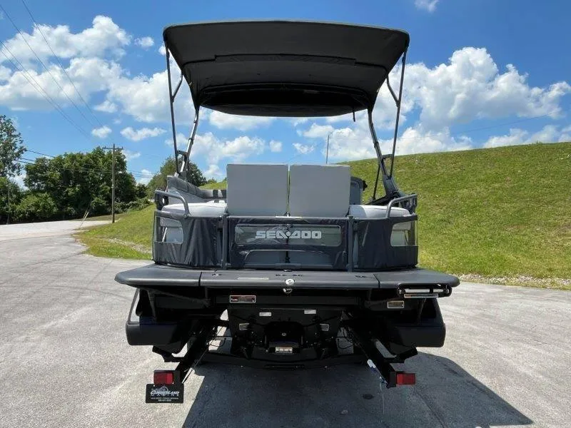 Slide: The Image of 2024 Sea-Doo Switch Cruise 21' 230HP pontoon boat, rear view, sunny day. - 7