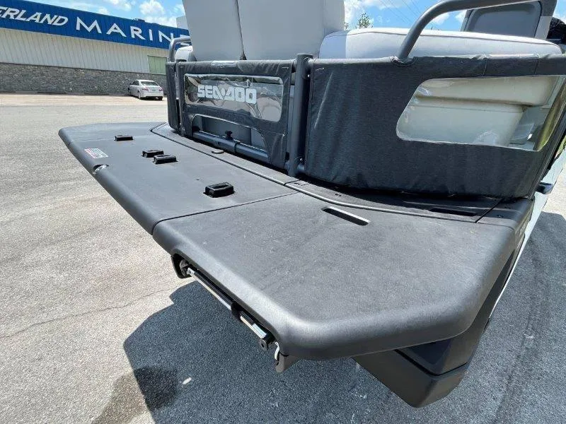 Slide: The Image of 2024 Sea-Doo Switch Cruise 21' 230HP rear deck view at a marina. - 9