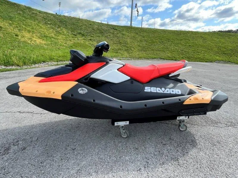 Slide: The Image of 2024 Sea-Doo Spark for 3 Rotax 900 ACE-90 with iBR and Audio, parked outdoors. - 13